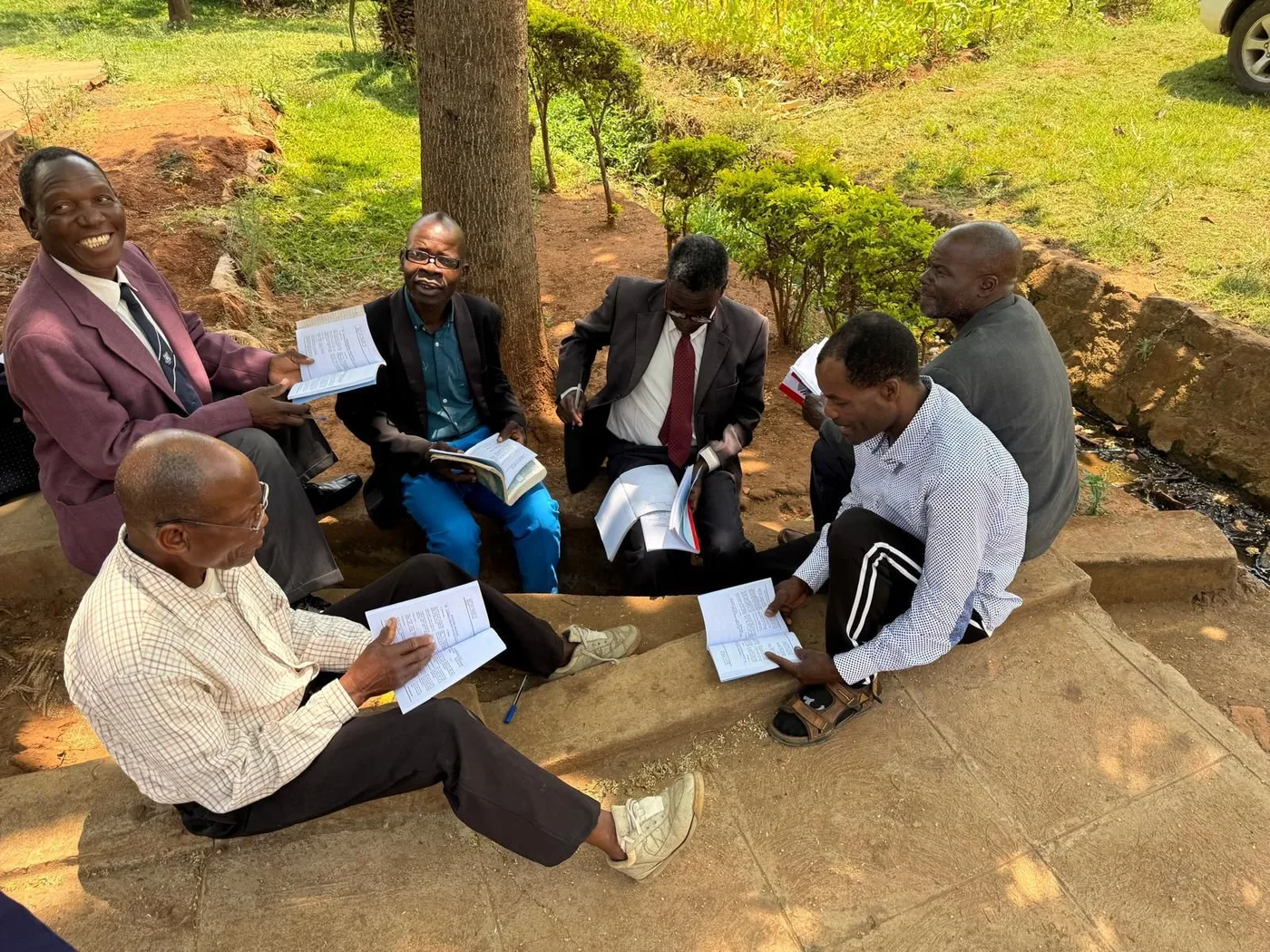 An EPW partner delivering boxes of translated biblical books to a pastor in the field